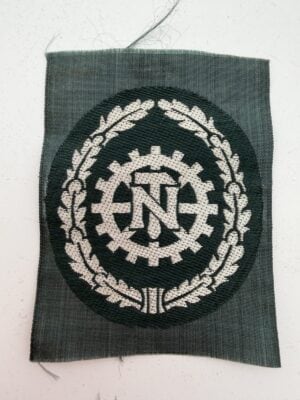 TeNo sleeve badge front showing the TN cogwheel and oak-leaf wreath on rectangular cloth