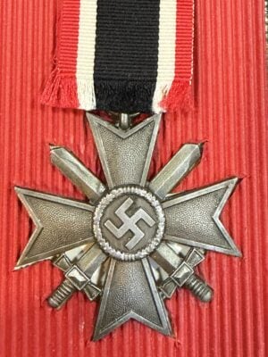 1939 War Merit Cross 2nd Class with Swords, obverse showing central wreath and accompanying ribbon.