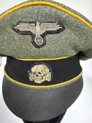 Waffen-SS cavalry crusher cap with yellow piping and woven insignia