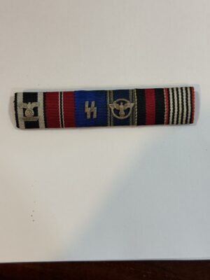 Original six-place SS ribbon bar with Iron Cross repeat clasp, SS runes and NSDAP long-service eagle.